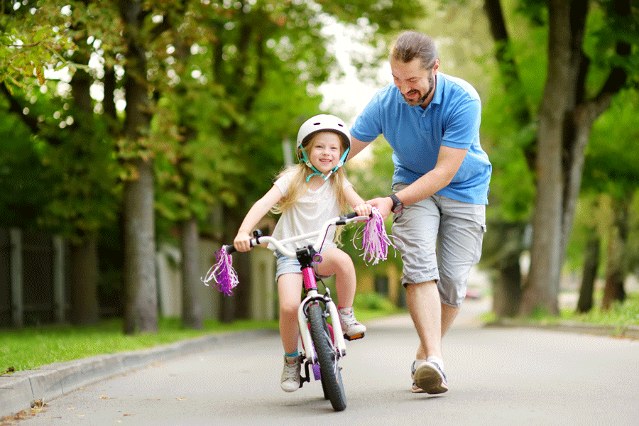 Kid-Learning-How-to-Ride-a-bike---AdobeStock_169609037