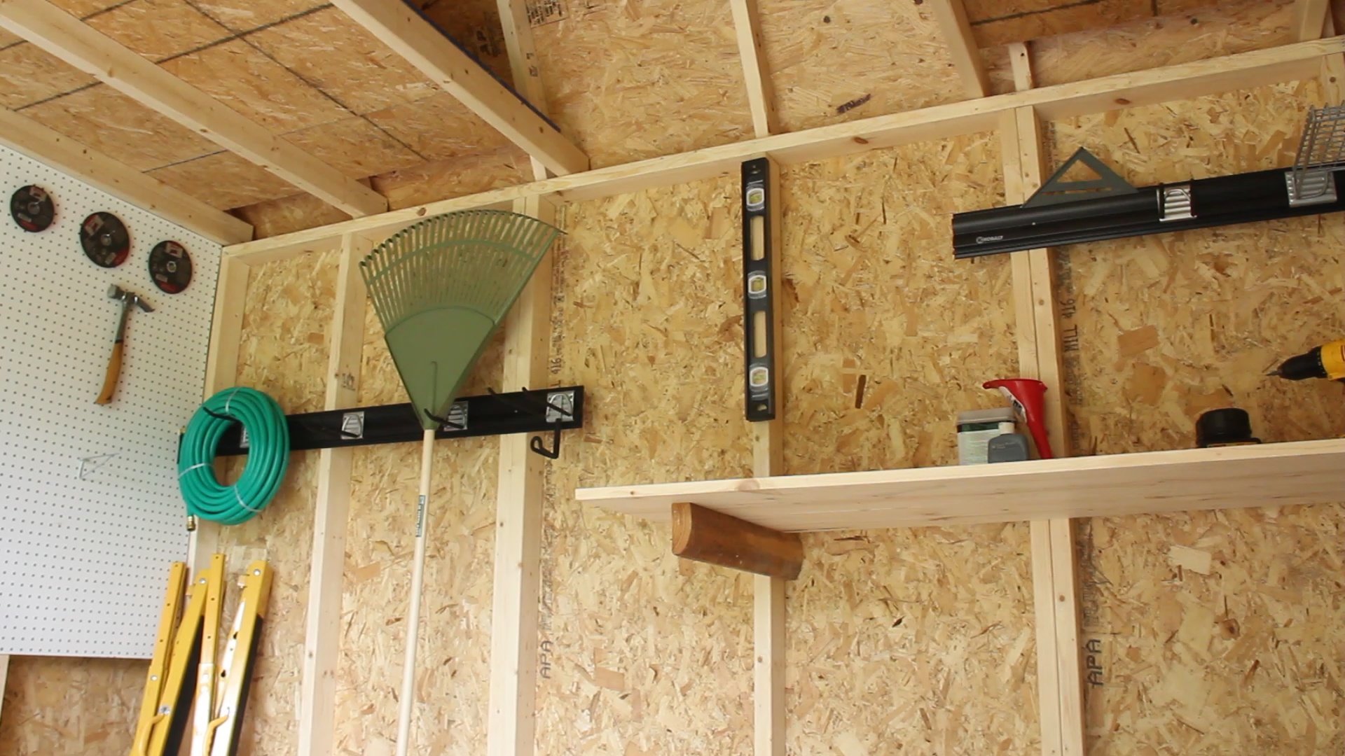 Shelving and hooks inside Cook shed 