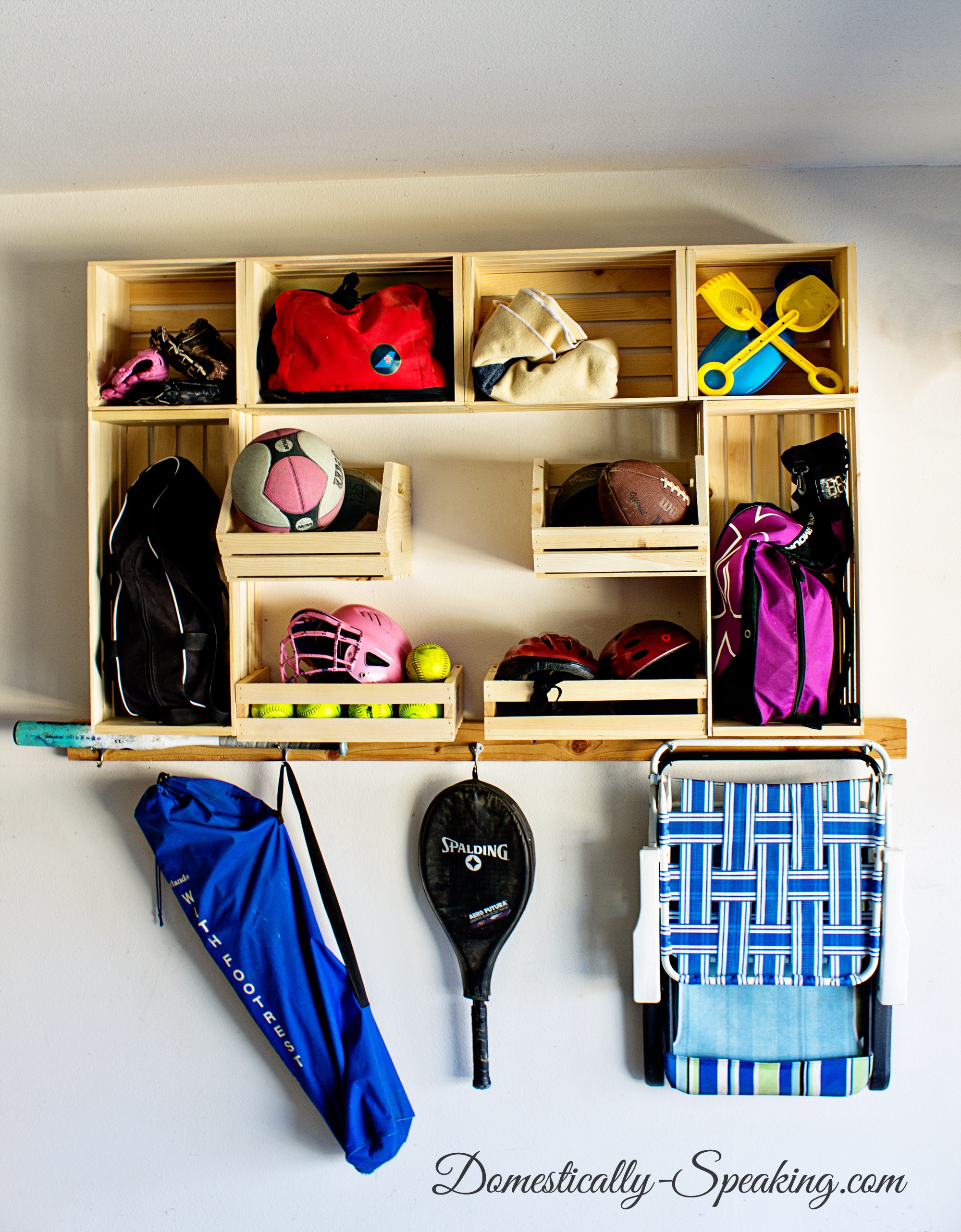 Garage-Sports-Organization-with-Crates from domestically speaking